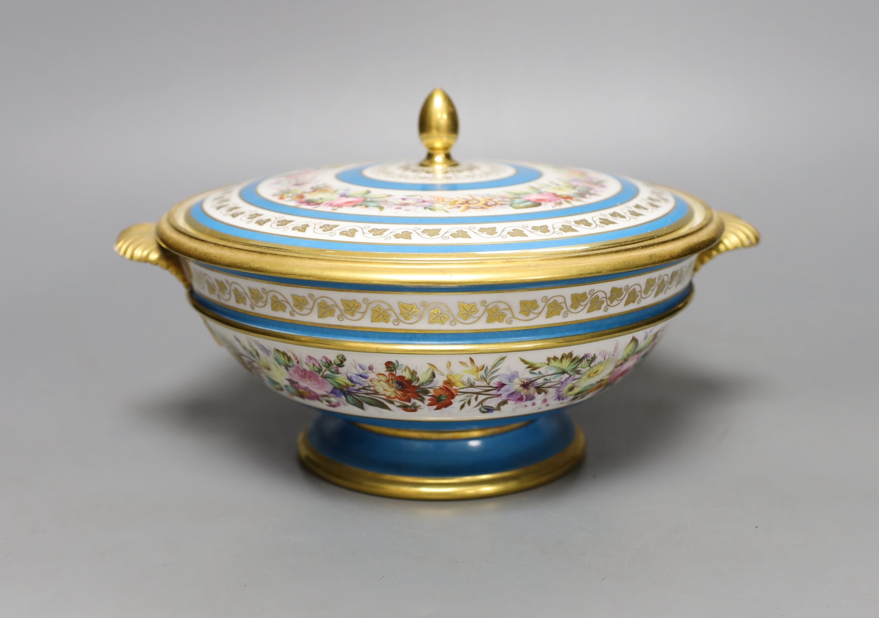 A Sevres ecuelle and cover, painted with a band of flowers surrounding the gilt monogram of Louis Phillipe, blue mark dated 1850, red mark for Chateau de Compiegne 25cm
